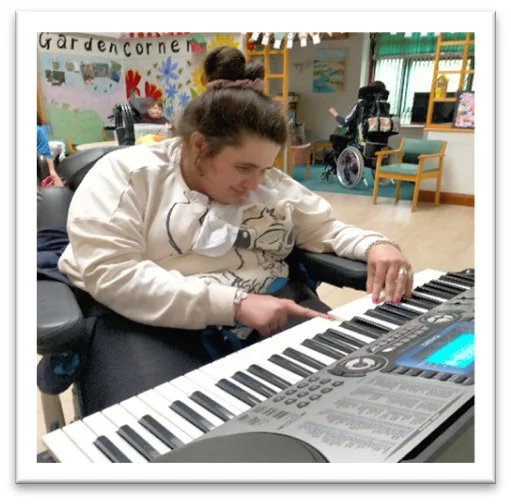 Aquamira Service User Playing A Keyboard