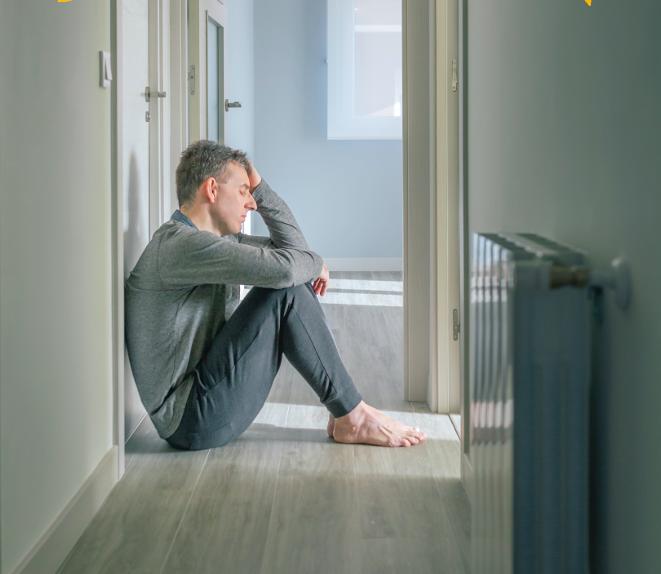 Man On Landing With Head In Hands